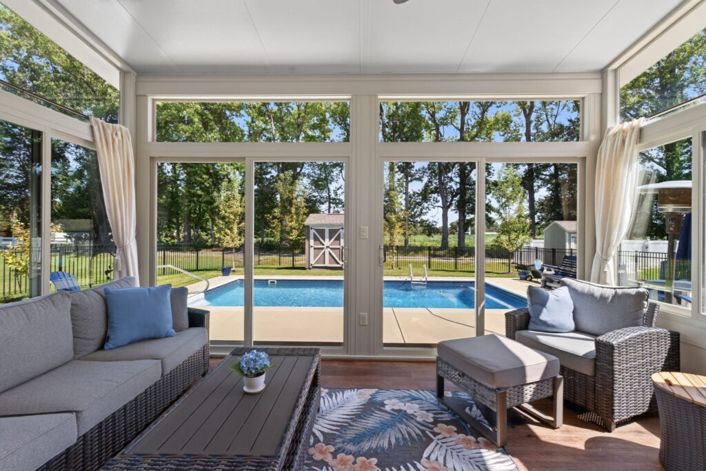 Comfortable Betterliving Sunroom interior with backyard views in Chesapeake, Virginia