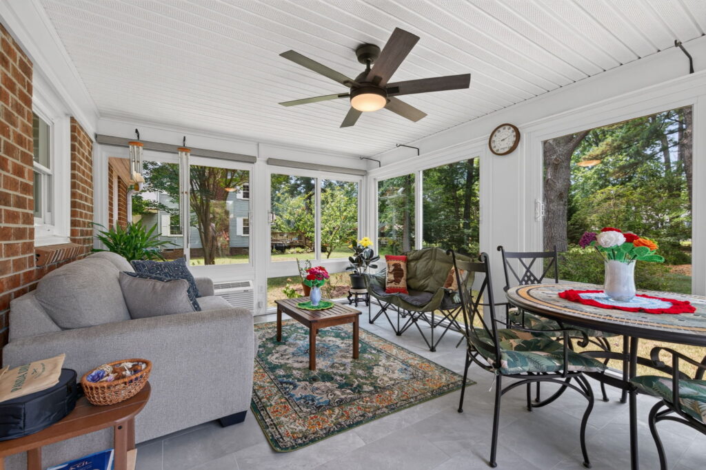 Climate-controlled four-season sunroom designed for relaxing, entertaining, and spending time with family.