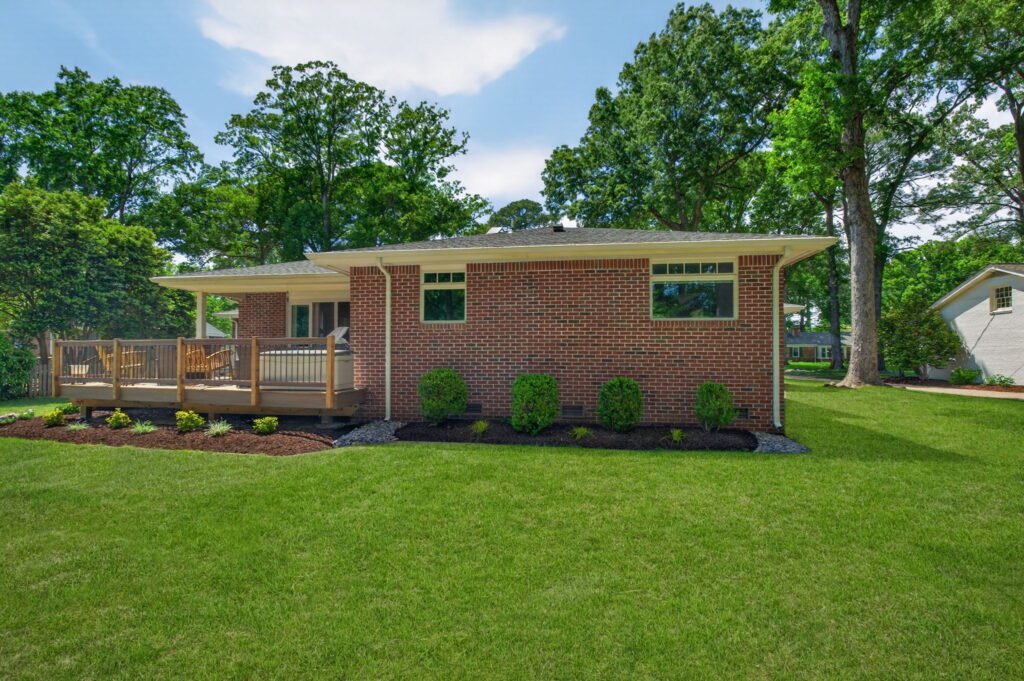 Functional home addition near outdoor deck space built to support entertaining and family events