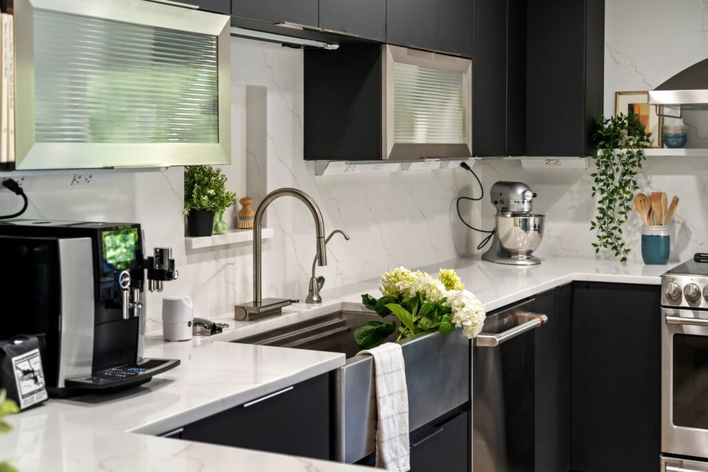 matte black cabinetry with calacatta miragio gold quartz countertops and backsplash