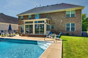 Finished Betterliving Four Season Sunroom interior overlooking pool in Chesapeake, VA