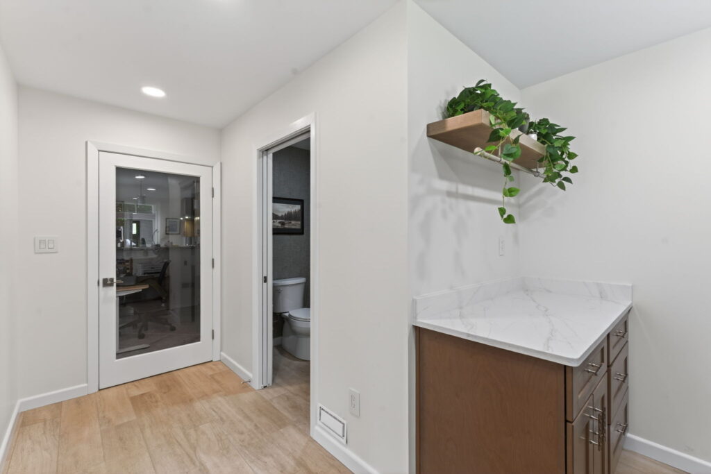 Functional bathroom addition near outdoor deck space built to support entertaining and family events.