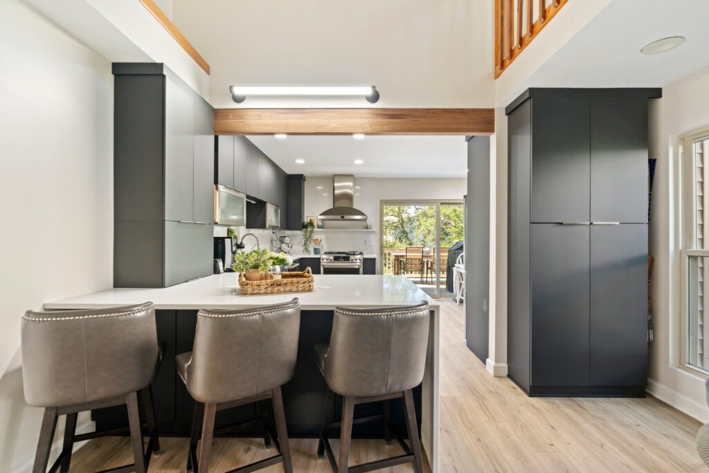 open concept kitchen with black matte cabinetry