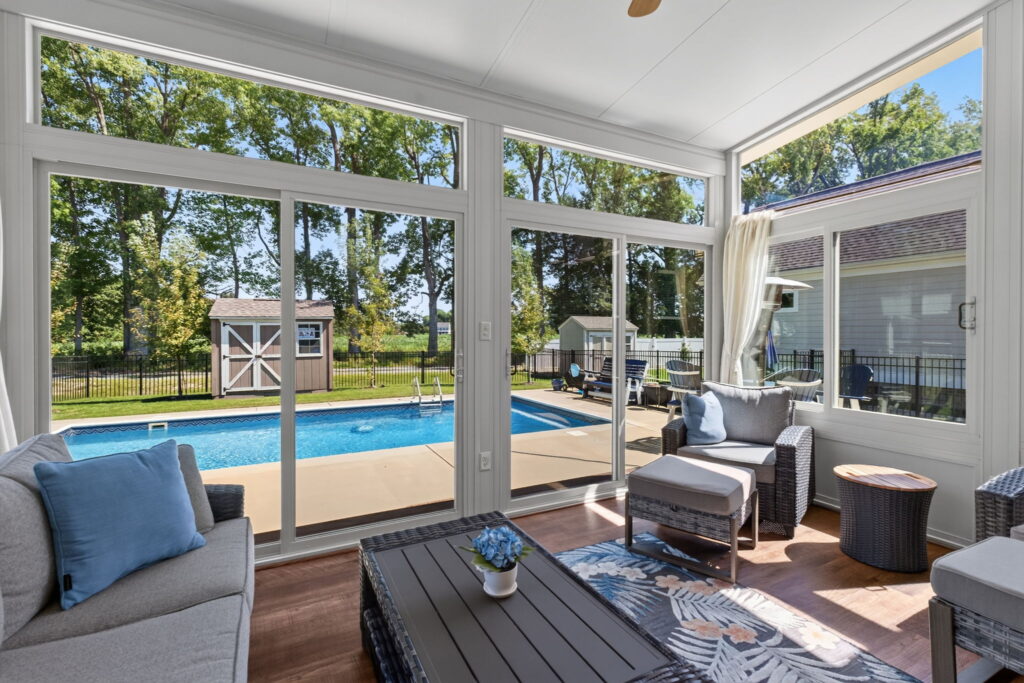 Bright Four Season Sunroom interior designed for relaxing and entertaining in Chesapeake, VA