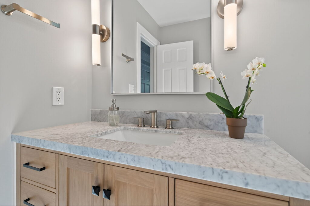 Design-forward bathroom featuring crisp lines, tiled surfaces, and modern finish selections.