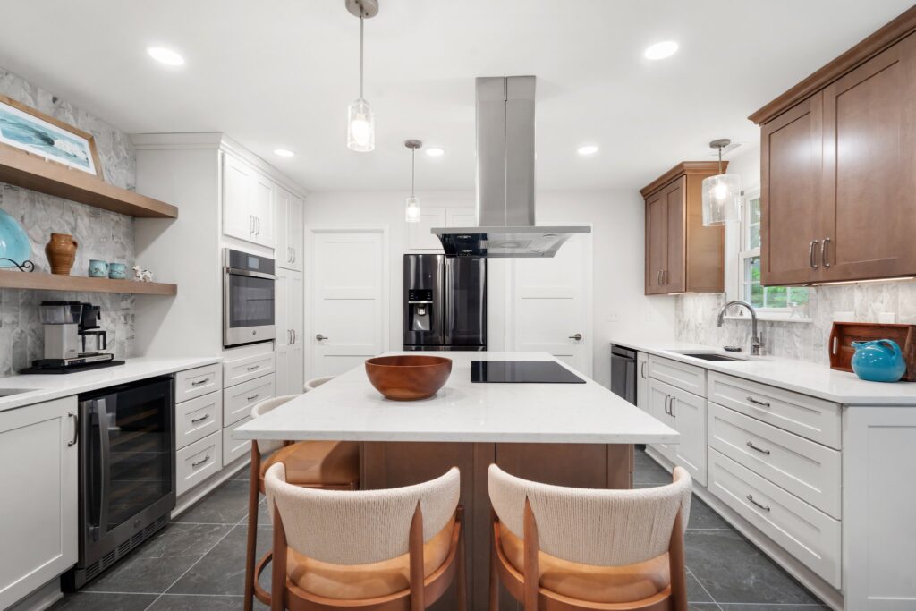 Open concept, warm materials, and balanced contrasts come together for a kitchen that feels serene and sophisticated.