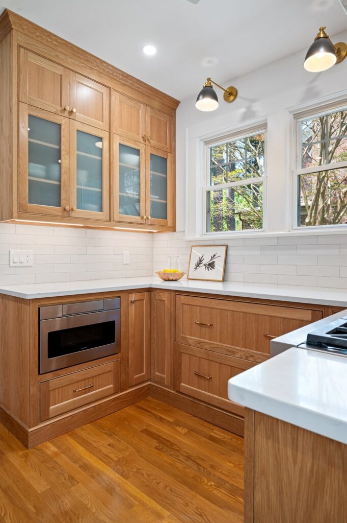 Custom white oak cabinetry with furniture base detailing