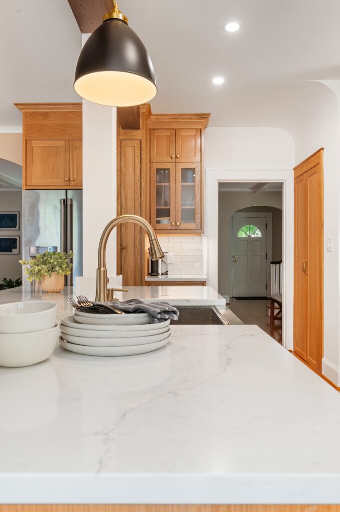 Quartz countertops and mixed metal hardware and lighting