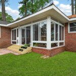 Existing covered porch converted into a comfortable 3 season sunroom by Betterliving Sunrooms & Awnings of Hampton Roads.
