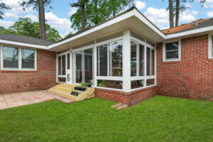 Existing covered porch converted into a comfortable 3 season sunroom by Betterliving Sunrooms & Awnings of Hampton Roads.