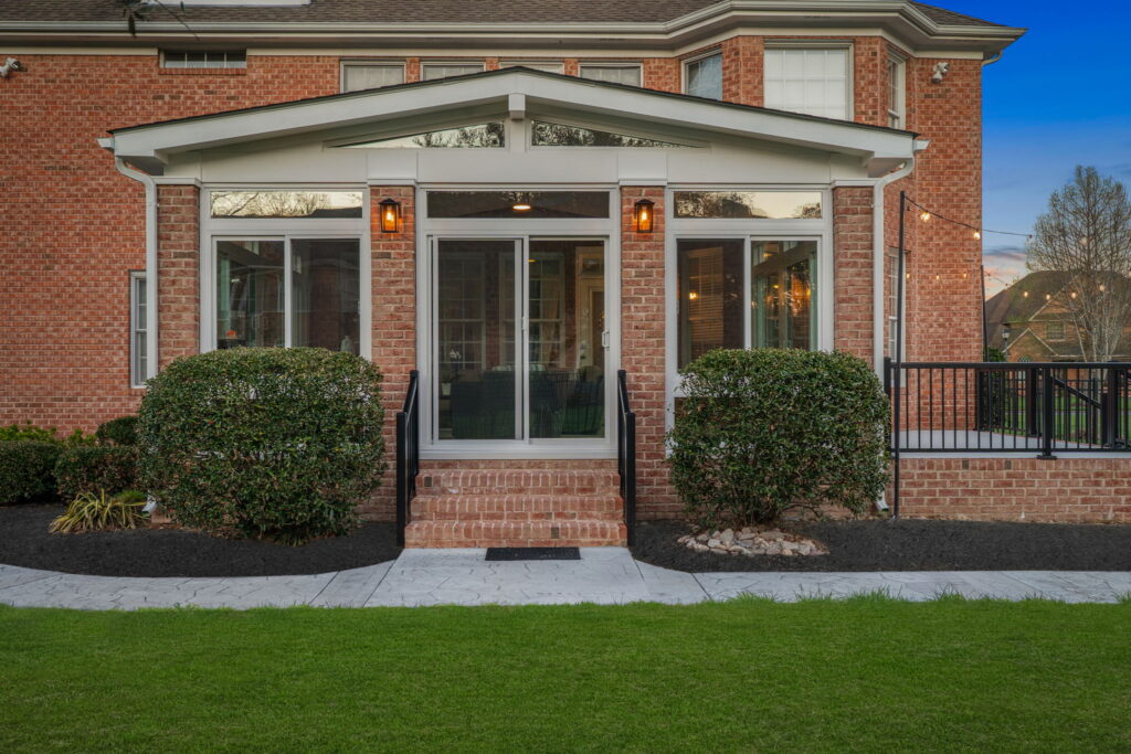 Custom sunroom designed to match brick home exterior in Chesapeake Virginia