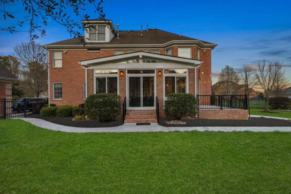 Custom sunroom designed to match brick home exterior in Chesapeake Virginia