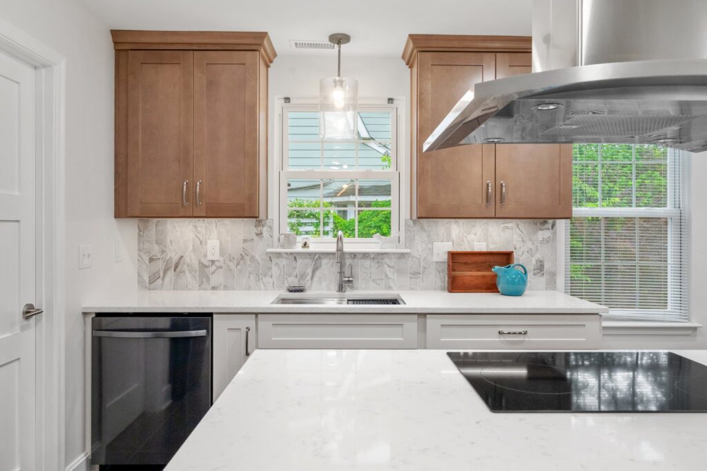 Custom Green Forest Park Place cabinets in Bianco and Smoked Cashew go in, adding texture and contrast.