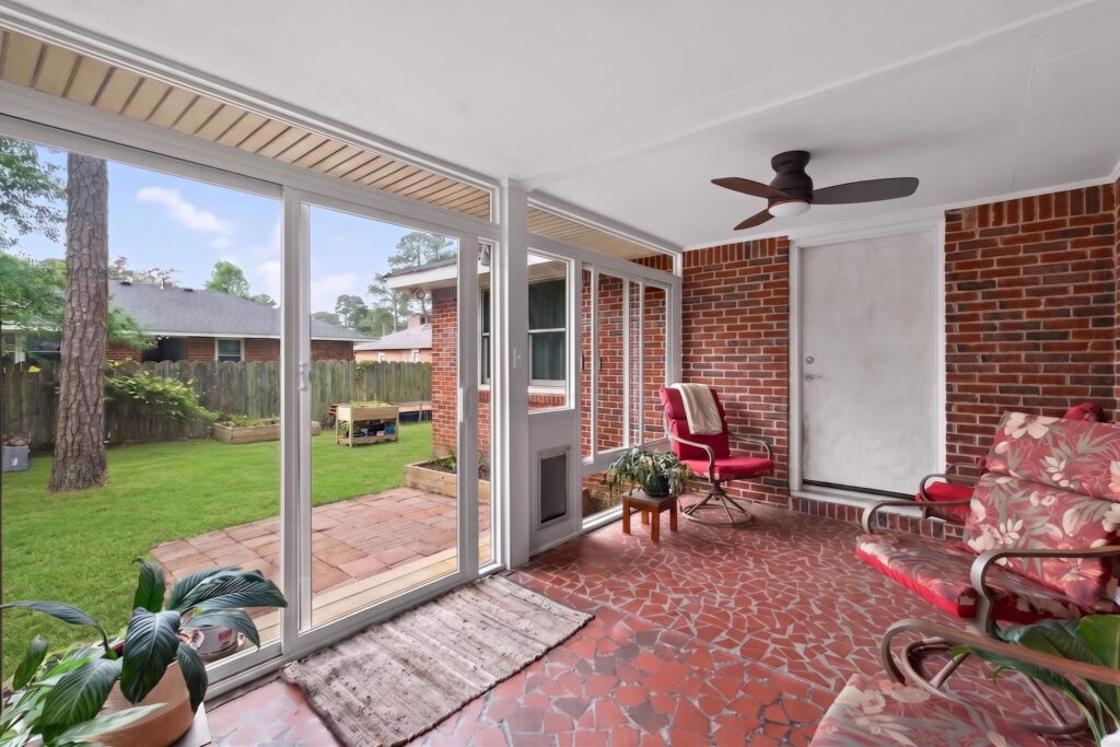 Existing covered porch converted into a comfortable 3 season sunroom by Betterliving Sunrooms & Awnings of Hampton Roads.