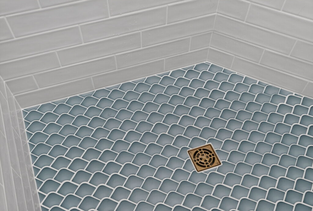 Glazzio Mermaids Collection tile flooring in remodeled bathroom