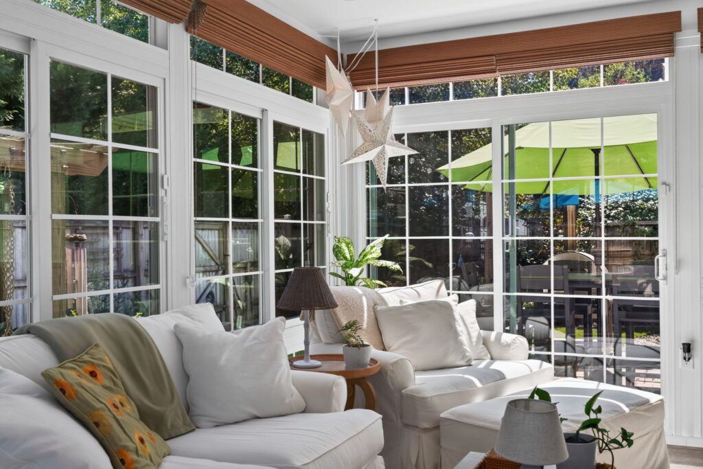 Cozy garden cottage style sunroom overlooking a Virginia Beach backyard