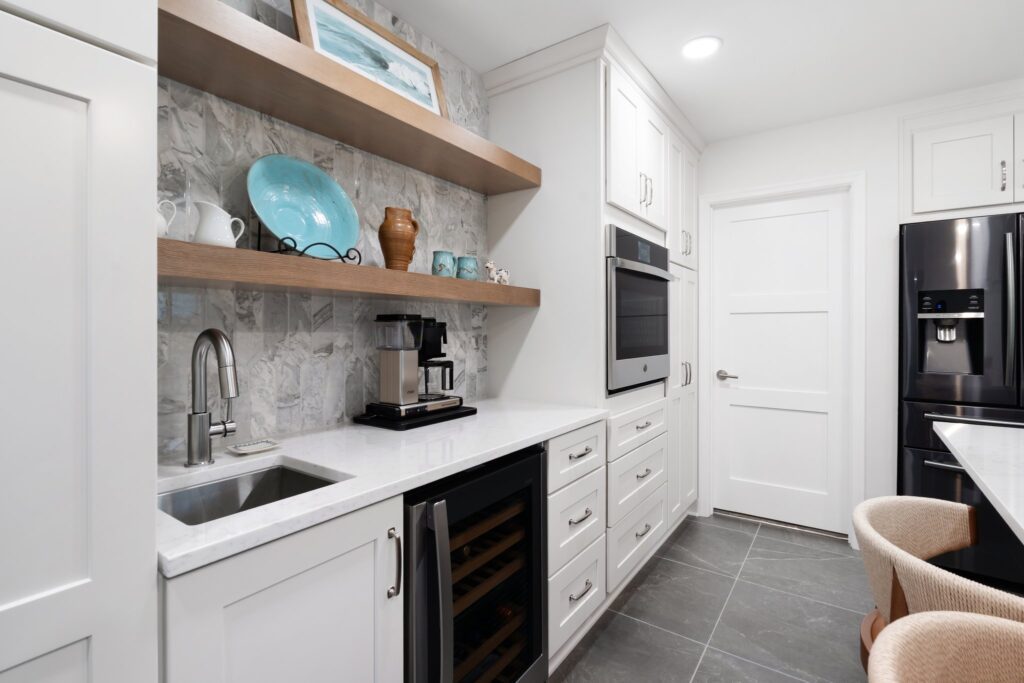 Bianco base cabinetry provides storage along the pantry wall — functional and beautiful.