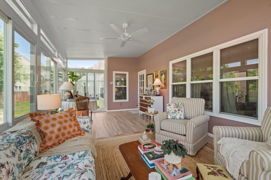 Sunroom with lounge area and natural sunlight - highlights the comfort of a climate-controlled space.
