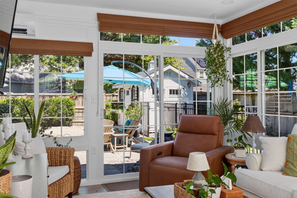 Garden view through the windows of a Virginia Beach Four Season Sunroom