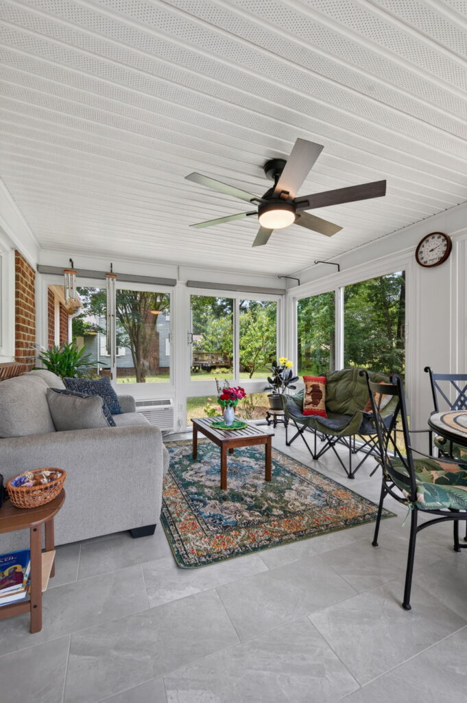 Finished Betterliving sunroom creating a comfortable gathering space for grandparents and grandchildren.