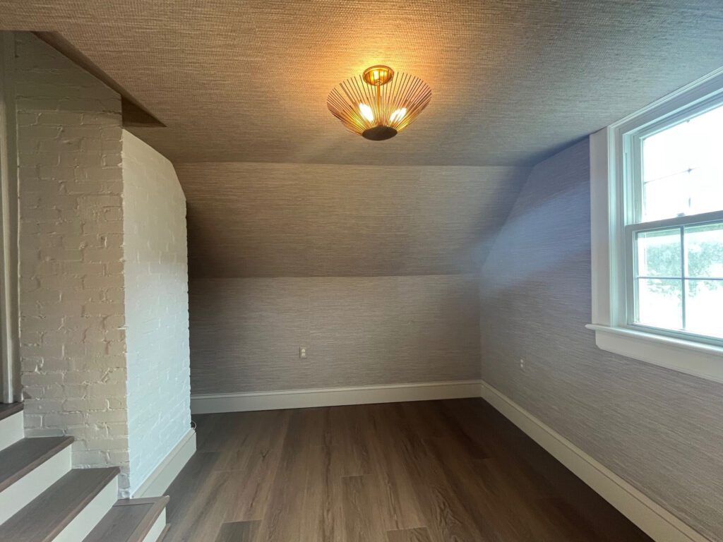 For the second-floor playroom (often called the FROG—Finished Room Over Garage), we created a playful yet polished space that balances design with durability.