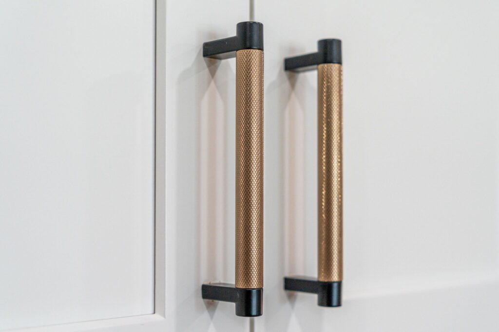 black and gold cabinetry pulls