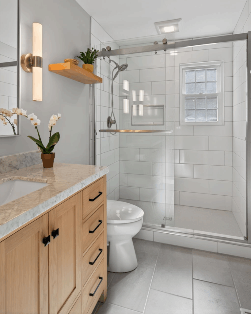 Fully remodeled Norfolk bathroom featuring clean modern design and improved use of space.