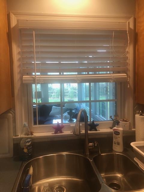 Kitchen sink and window before kitchen remodel.